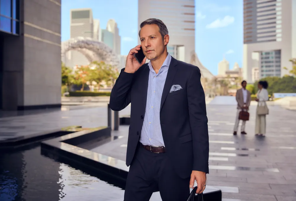 A business meeting in a modern Dubai setting — representing the corporate and high-net-worth travellers who book private charters.