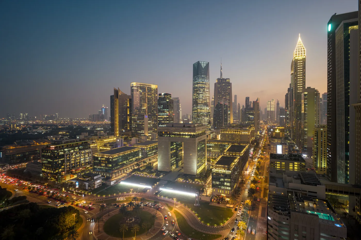 Dubai's DIFC business district at dusk — the financial and corporate hub driving high-spend business and leisure travel into the city.