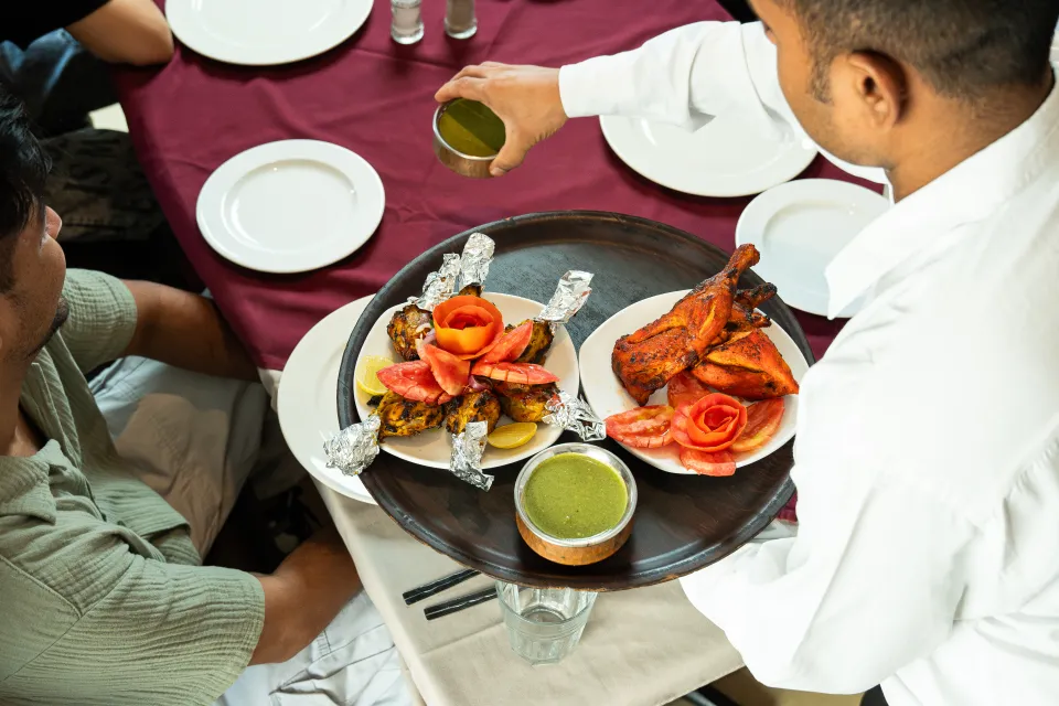 Group dining laid out on board a Dubai yacht